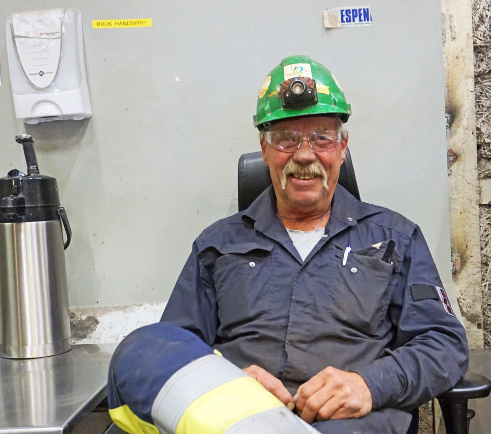 man sitting in a chair in the workshop