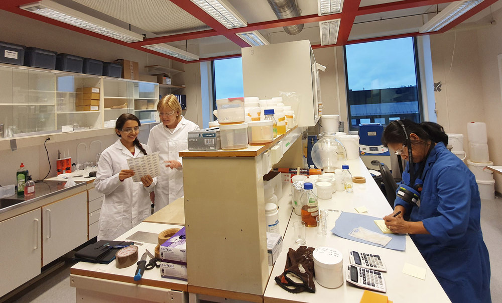three people at work in lab