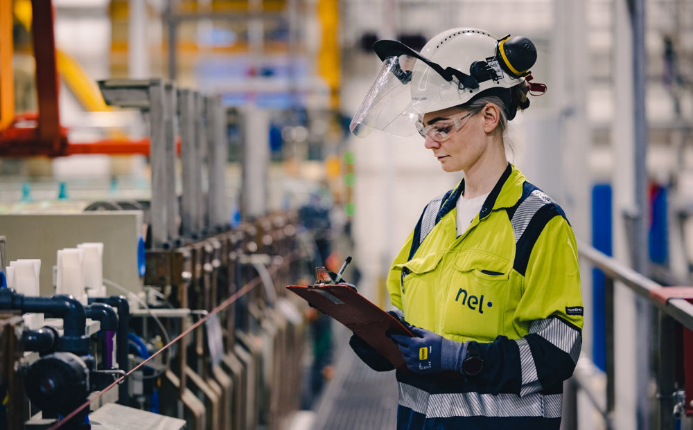 young woman doing inspection work at proction line