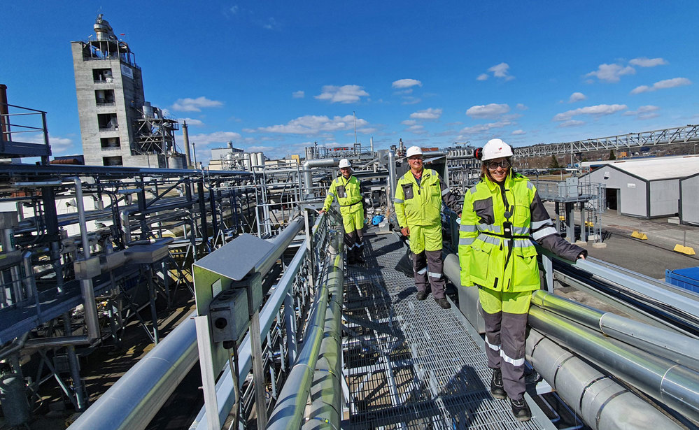 three people standing on a multiphase rig, posing