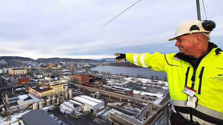 man standing on top of building pointing with finger 