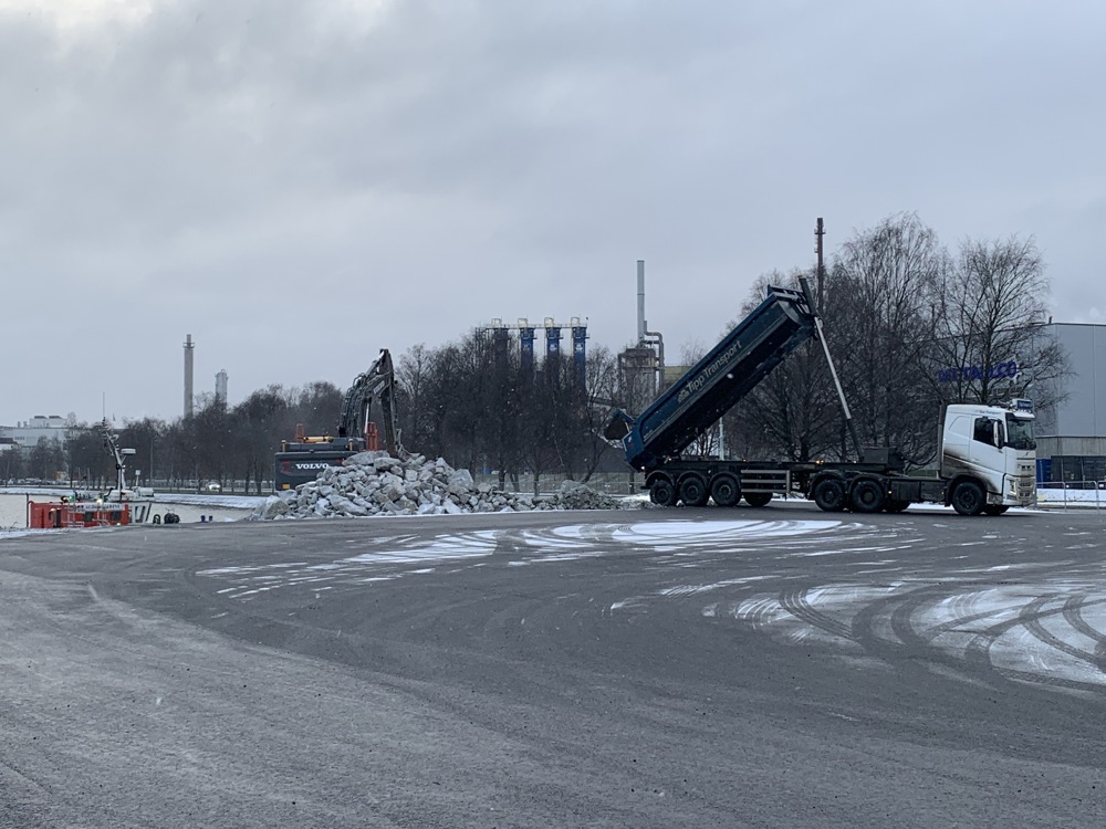 vehicle unloading  stone masses on a construction site.