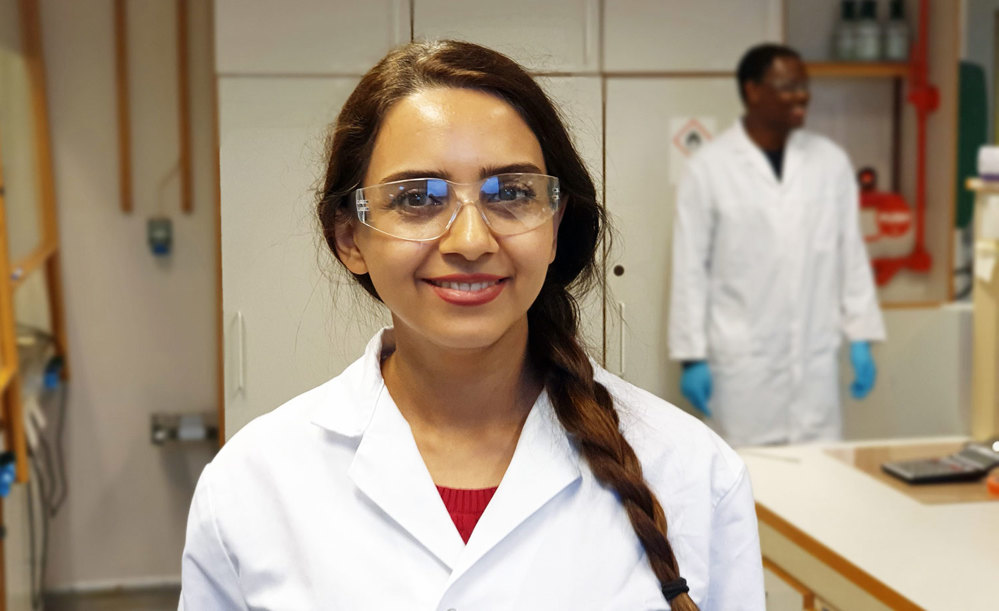 portrait of young woman, with lab coat, lab