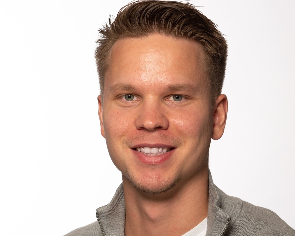 portrait of young man, short dark blond hair